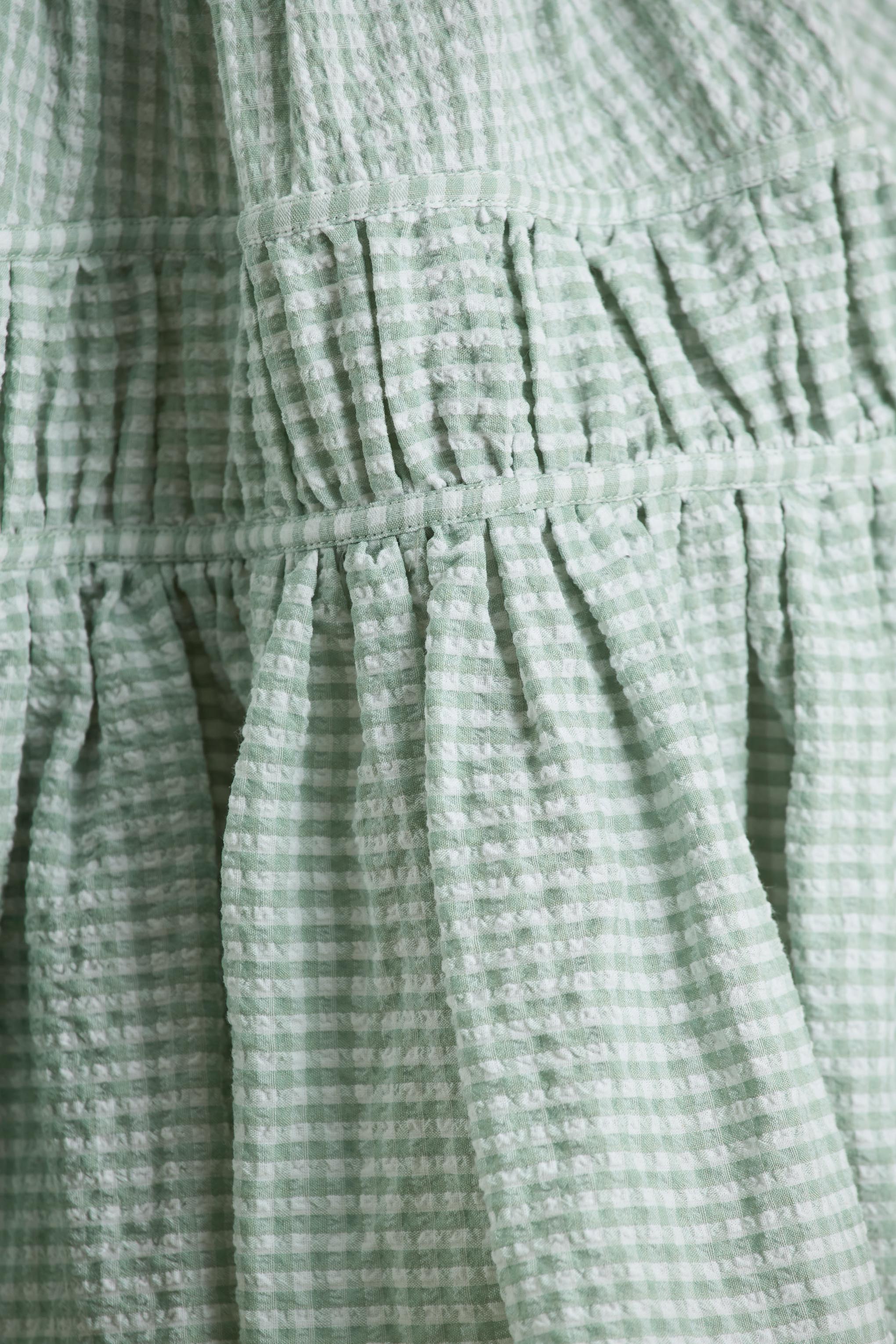 Laurelle Green Extreme Plunge Neck Mini Dress With Ruffling Detail